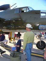 115-B-25-provide_donation_to_tour_inside_of_aircraft