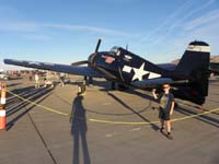 138-Kenny_with_F6F_Hellcat-rear_side_view