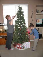 44-Mommy_and_Kenny_decorating_Christmas_tree-since_not_moving,we_get_to_have_Christmas_at_our_house