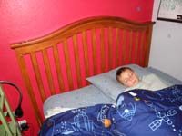 55-Kenny_sound_asleep_with_his_tooth_on_the_headboard-and_look_the_tooth_fairy_already_left_a_coin