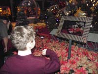 49-waiving_to_camera_on_train_at_Bellagio_Conservatory