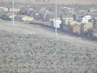 11-zoom_view_of_where_our_new_home_will_be_built-against_wall_to_left_of_white_one_in_center