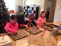 05-Brooke,Kenny,Leyna_making_cookies_on_Christmas_Eve