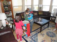 08-unwrapping_presents_at_Baba_and_Poppy's_house-pillow_Baba_made-quickly_became_a_favorite_at_home