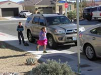 12-kids_having_fun_outside_with_Kenny's_remote_control_vehicle