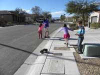 13-kids_having_fun_outside_with_Kenny's_remote_control_vehicle