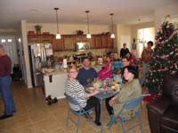17-Christmas_dinner-kids_get_to_sit_at_the_kiddie_table-parents_at_the_good_table_in_distance