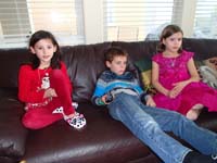 18-Brooke,Kenny,Leyna_relaxing_on_the_couch_watching_TV_after_a_big_Christmas_dinner