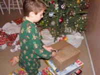 26-Kenny_opens_his_present_from_Daddy-oh_boy_be_careful_using_those_scissors