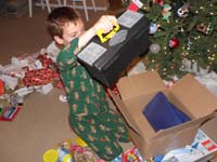 27-Kenny_opens_his_present_from_Daddy-look_it_is_a_tool_box