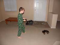 34-plays_with_his_remote_controlled_truck_in_the_house-until_Mommy_kicked_him_out