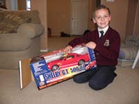 13-Kenny_is_very_excited_to_get_a_used_RC_car_Shelby_GT500_Mustang_from_Larry_Dunn-friend_of_Daddy's