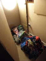 21-relaxing_in_box_fort_after_swim_meet