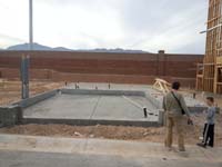 27-Daddy_and_Kenny_checking_out_the_foundation_of_our_new_house