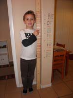 70-measuring_Kenny's_height-53.75_inches-can't_mark_on_wall_anymore_since_we_don't_own_the_house