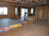 32-Kenny_checking_out_the_great_room_and_kitchen