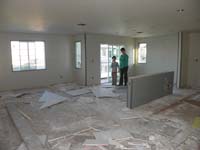 53-Kenny_and_Mommy_in_the_great_room_and_kitchen_area-sure_is_a_big_mess