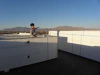 58-Kenny_on_planters_box_pointing_to_Gass_Peak-hard_to_believe_we_were_just_on_that_mountain_a_few_hours_ago