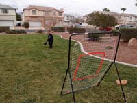 13-he_has_trouble_catching_the_ball_when_it_bounces_back-he'll_get_better_quicker_than_he_realizes