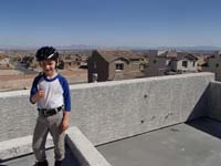 19-Kenny_is_very_happy_to_have_a_Strip_view_from_roof_top_deck_planters_box