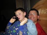 34-Kenny_sitting_on_Daddy_in_bed_while_watching_'Back_to_the_Future'-saw_DeLorean_at_baseball_opening_ceremonies