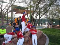 08-the_kids_want_to_play_on_the_rocks-trying_to_keep_uniforms_clean-just_got_them_before_pictures