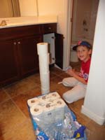 14-Kenny_was_a_big_helper,now_loading_the_toilet_paper_into_the_bathrooms