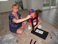 16-Mommy_and_Kenny_putting_together_the_stools_for_the_super_island
