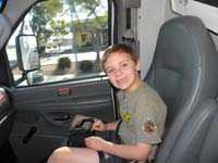 31-20150418-0830-Kenny_gets_to_legally_ride_in_the_front_seat_of_a_vehicle-rental_truck