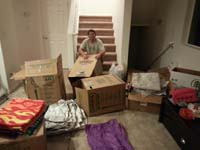 48-Daddy_organizing_the_boxes_and_contents_for_recycling_and_reuse