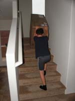 31-new_ottoman_box_has_arrived,Kenny_pushes_it_up_the_stairs-he_also_rolls_it