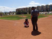 11-Kenny_warming_up_the_pitcher_as_catcher