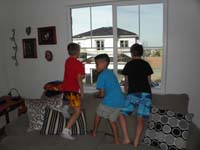12-Aiden,Adrian,Kenny_looking_out_window_looking_for_another_guest_to_arrive