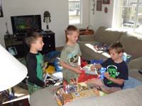 53-Kaden_and_Aiden_watch_Kenny_open_his_presents