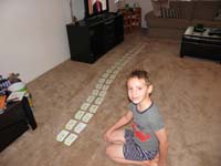 01-Kenny_practicing_with_the_division_cards-he_has_trouble_memorizing_them_for_speed_for_school
