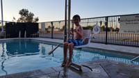 46-spends_the_morning_swimming_so_what_to_do-swim_at_hotel_pool-Kenny_sitting_in_handicap_chair