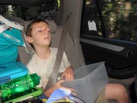 01-Kenny_is_feeling_sick-he_has_his_bucket-Mommy_takes_turns_fast_and_hard_through_mountains