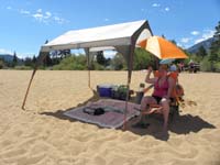 14-Mommy_relaxes_with_our_tent_cover-critical_to_not_burn