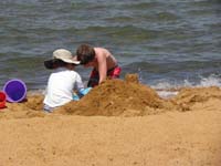21-they_are_busy_building_a_fort_and_digging_in_the_sand