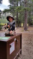 06-Kenny_working_on_his_Junior_Ranger_program_outside_the_Visitors_Center