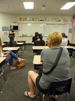 18-Mommy_sitting_in_Kenny's_seat_during_school_orientation_night_for_parents