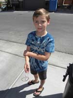 20-Kenny_holding_small_dead_snake_Daddy_found_in_corner_of_garage-he's_not_thrilled