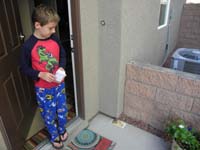 59-Kenny_looking_at_Cactus_Deermouse_stuck_on_glue_board_Daddy_uses_to_catch_bugs-too_bad_mouse_got_stuck