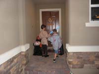 08-Kenny_trick_or_treating_with_neighborhood_friend_Bryson