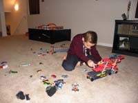 16-Kenny_having_lots_of_fun_with_a_new_toy-cradle_truck_for_all_his_cars