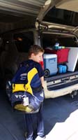 29-Kenny_showing_off_his_new_swimming_backpack-off_to_day_two_for_swim_meet