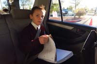 24-Kenny_studying_in_car_on_the_way_to_school