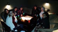 34-Meyer_annual_cookie_exchange_party-woman_hanging_out_on_roof-top_deck_with_heater