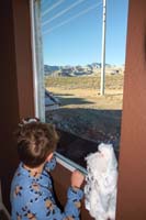 53-taking_a_break_checking_out_the_snowy_mountain_view_outside_back_window