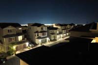 23-neighborhood_at_night_from_rooftop_deck